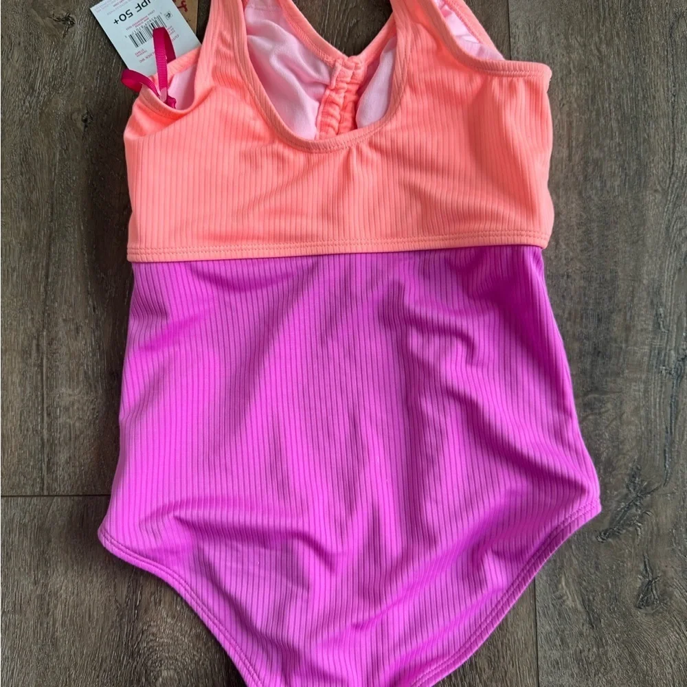 Justice Swimming Suit. One piece. Girl’s size medium (10). New with tags!